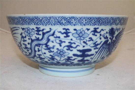 A Chinese blue and white phoenix bowl , Kangxi/Yongzheng period, 21.5cm, cracks